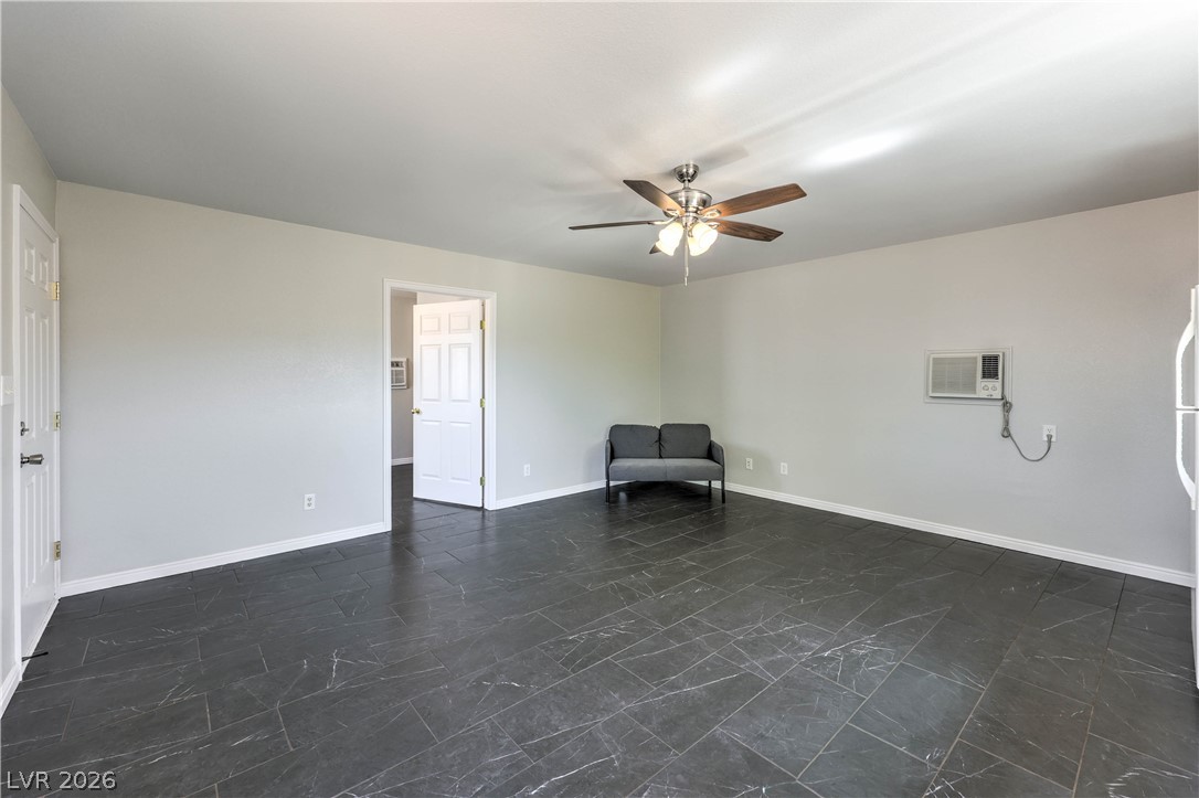 348 Tres Palomas Street Overton, NV 89040 - Photo 31 of 41 A living space offers a smooth tile flooring and a ceiling fan for comfort.