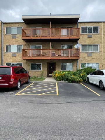 a view of a car park in front of a building
