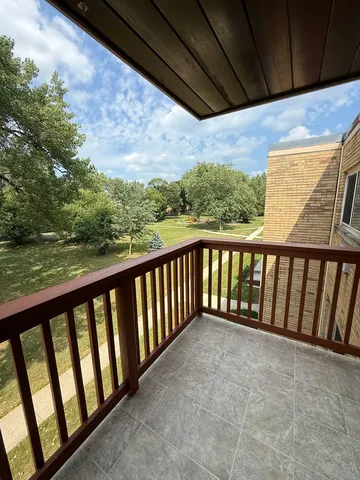 a view of balcony and yard