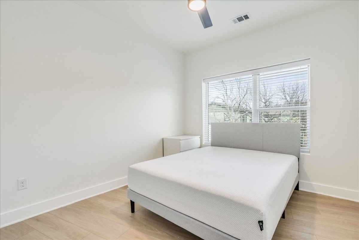 3000 Duval Street, Unit 203 Austin, TX 78705 - Photo 10 of 27 a large white bed in a white room