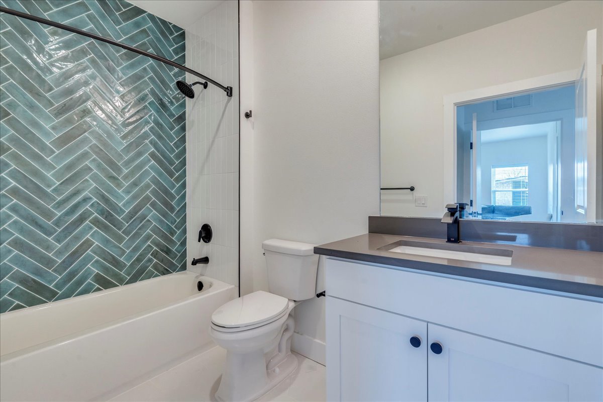 3000 Duval Street, Unit 203 Austin, TX 78705 - Photo 12 of 27 a bathroom with a sink a toilet and shower
