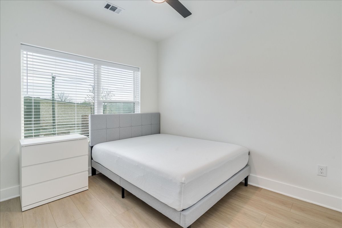 3000 Duval Street, Unit 203 Austin, TX 78705 - Photo 16 of 27 a bedroom with a bed and a window
