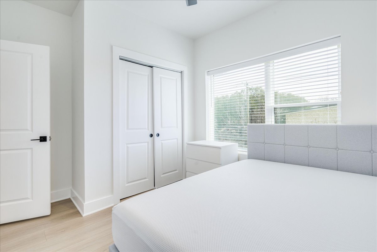 3000 Duval Street, Unit 203 Austin, TX 78705 - Photo 17 of 27 a bedroom with a bed and a window