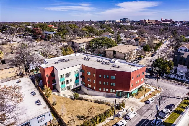 a view of a building with sitting area