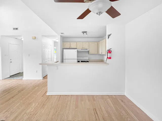 a stove top oven sitting inside of a kitchen
