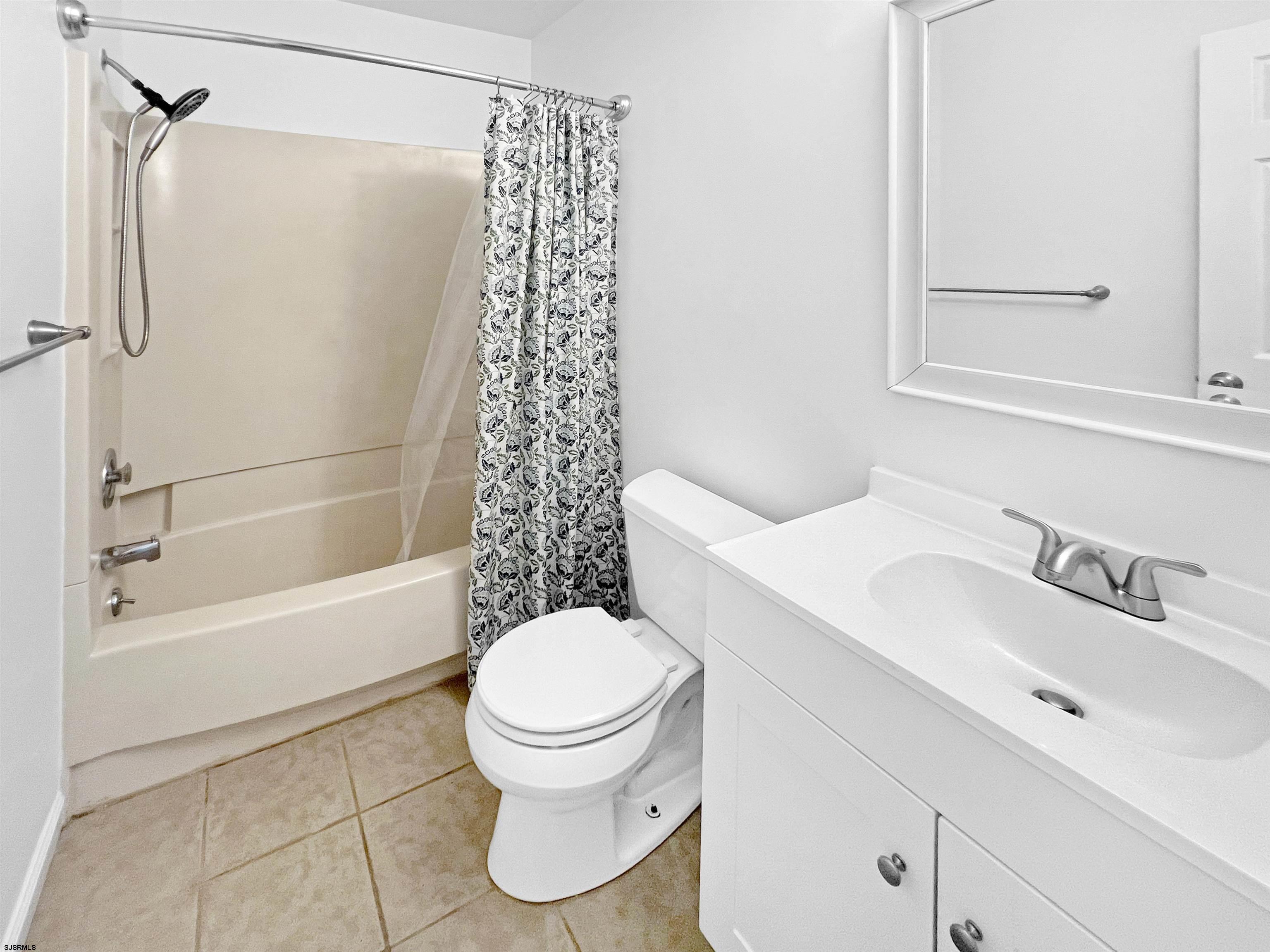 168 Westchester Drive, Unit 168 Little Egg Harbor, NJ 08087 - Photo 17 of 21 a bathroom with a sink toilet and shower