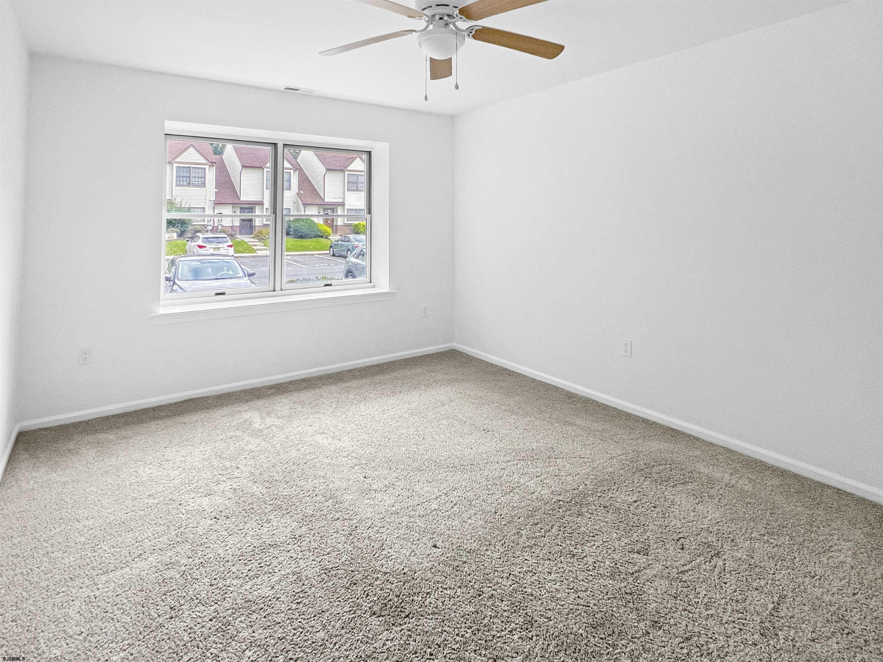 168 Westchester Drive, Unit 168 Little Egg Harbor, NJ 08087 - Photo 18 of 21 an empty room with a window