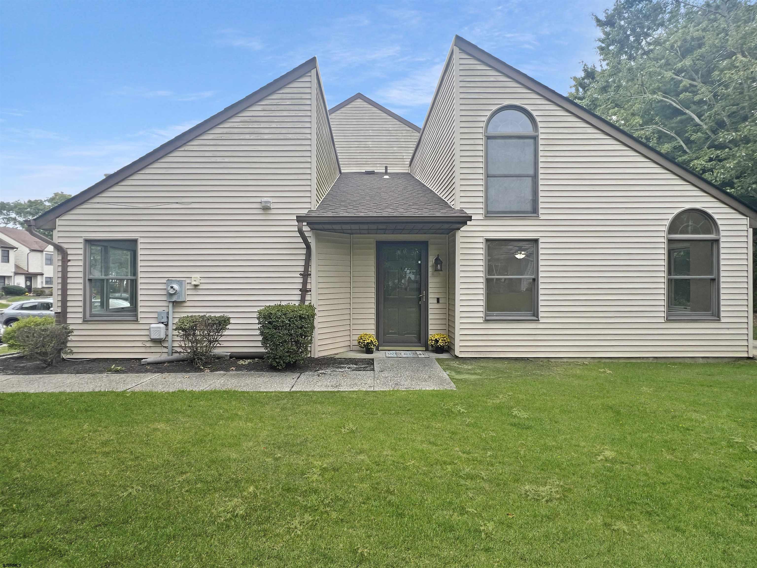 168 Westchester Drive, Unit 168 Little Egg Harbor, NJ 08087 - Photo 4 of 21 a view of a house with a backyard