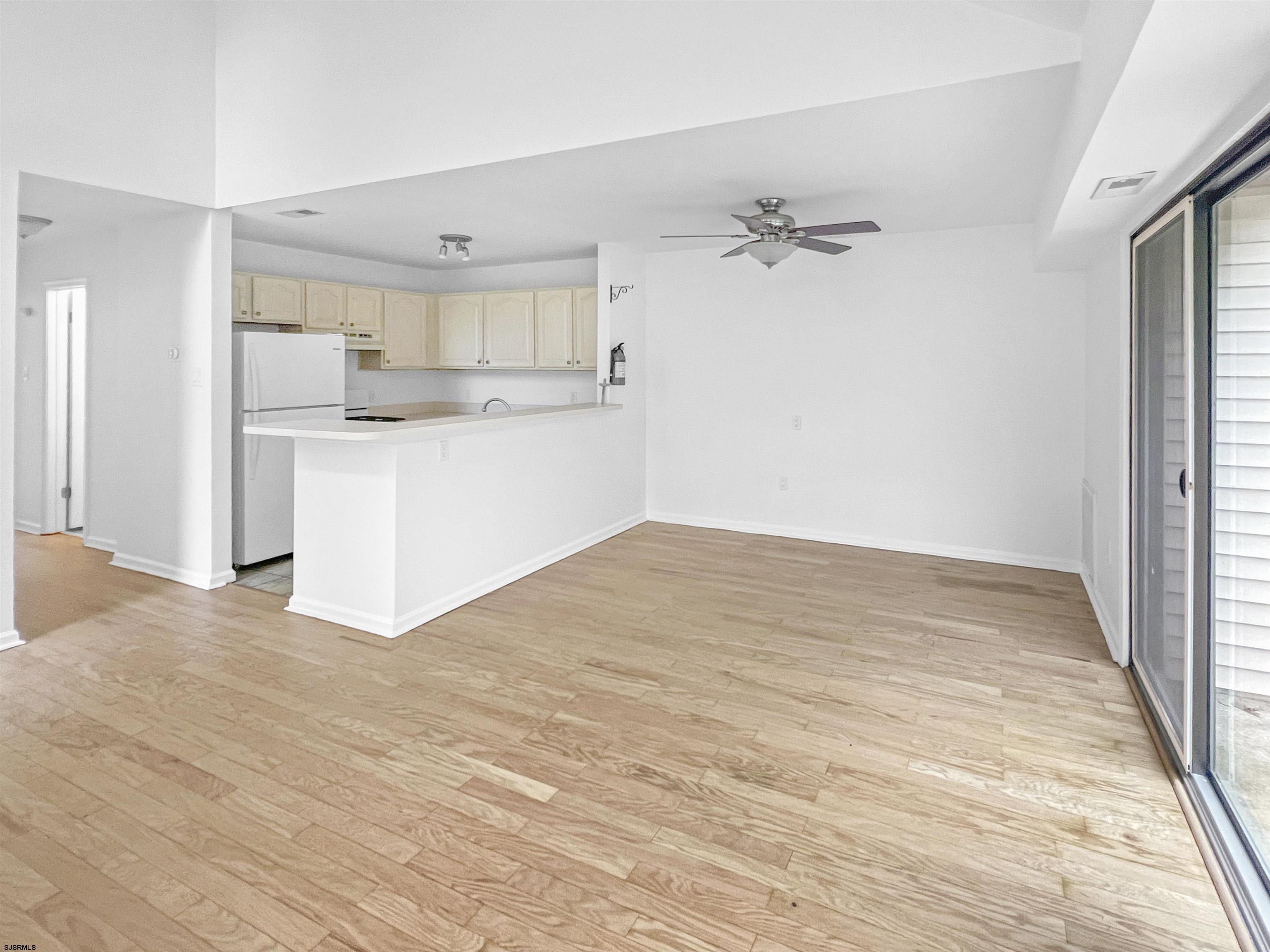 168 Westchester Drive, Unit 168 Little Egg Harbor, NJ 08087 - Photo 9 of 21 a view of a kitchen with wooden floor