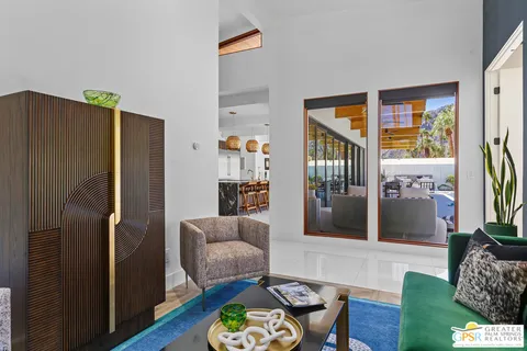 a bedroom with a bed and a lamp