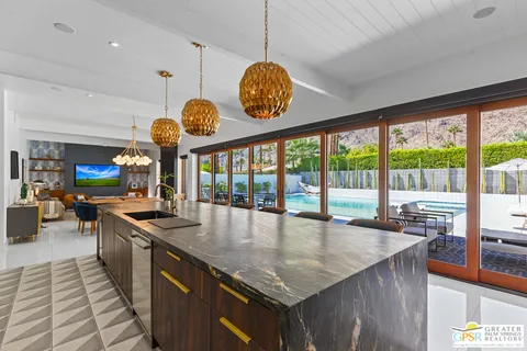 a bathroom with a sink a mirror and a shower