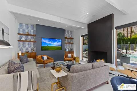 a view of a house with backyard porch and sitting area