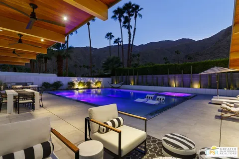 a living room with fireplace furniture and a flat screen tv