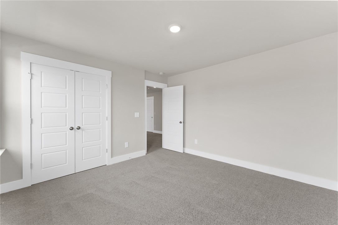 167 Tiger Lily Drive Anderson, SC 29621 - Photo 21 of 34 A spacious room offers plush gray carpeting and clean white trim.