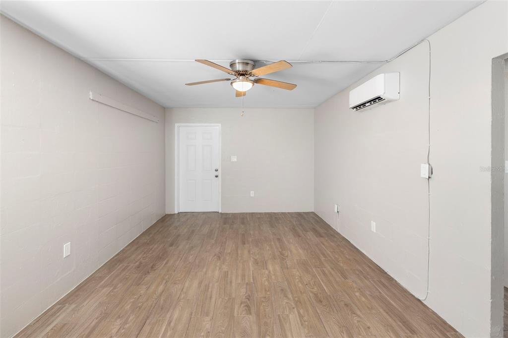 901 Colyer Street, Unit A & B Orlando, FL 32805 - Photo 12 of 32 an empty room with windows and fan