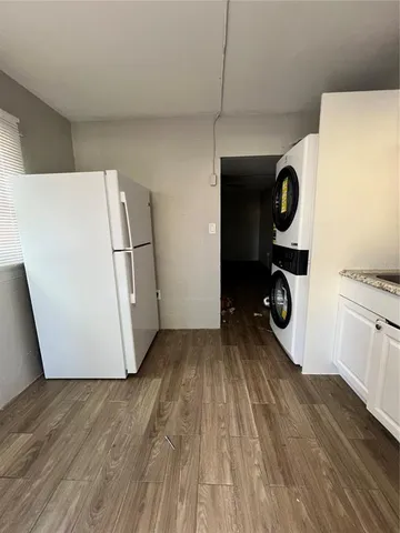 a view of kitchen and wooden floor
