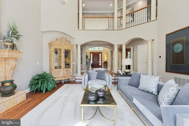 a living room with furniture cabinets and book shelf