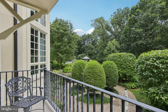 a bathroom with a granite countertop bathtub a sink and a shower