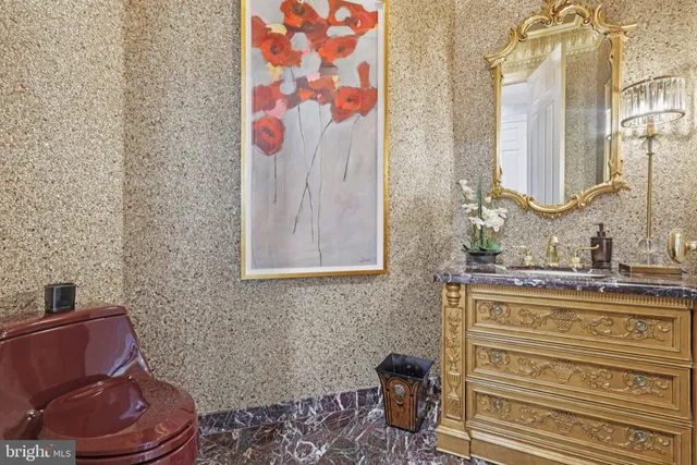 a bathroom with a granite countertop sink a mirror and shower