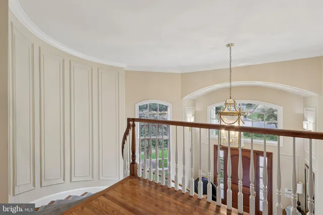 a dining room with furniture window and wooden floor