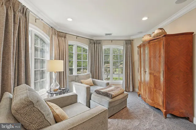 a view of a house with a yard and sitting area