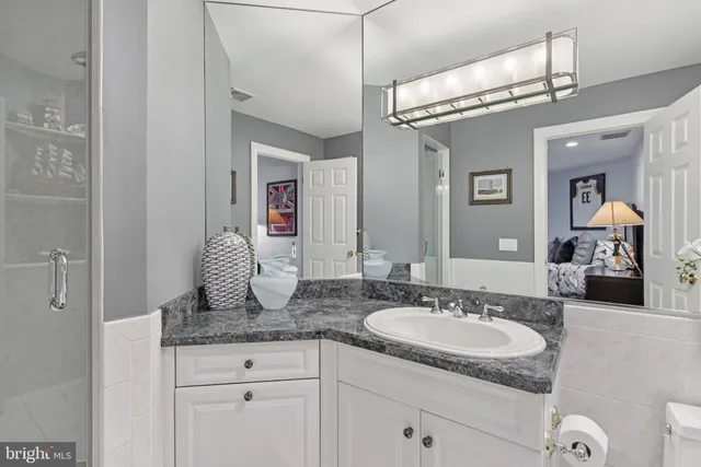 an aerial view of a house with a yard and lake view