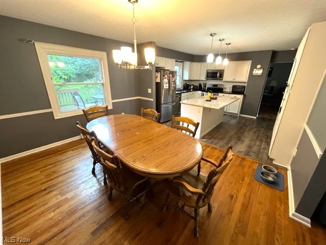 934 Andrews Road Medina, OH 44256 - Photo 9 of 27 Hardwood floored dining space with a chandelier