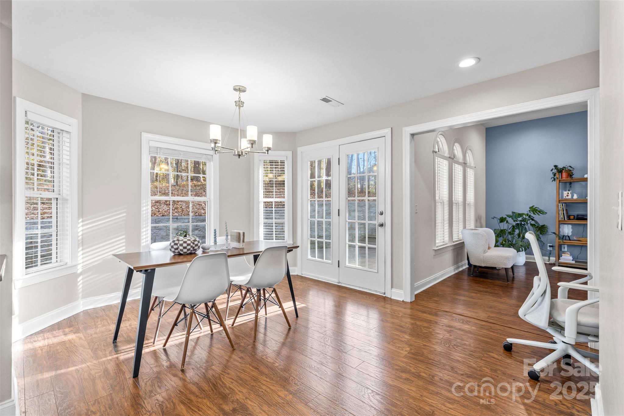1108 Blowing Rock Cove Fort Mill, SC 29708 - Photo 11 of 43 a view of a dining room with furniture window and wooden floor