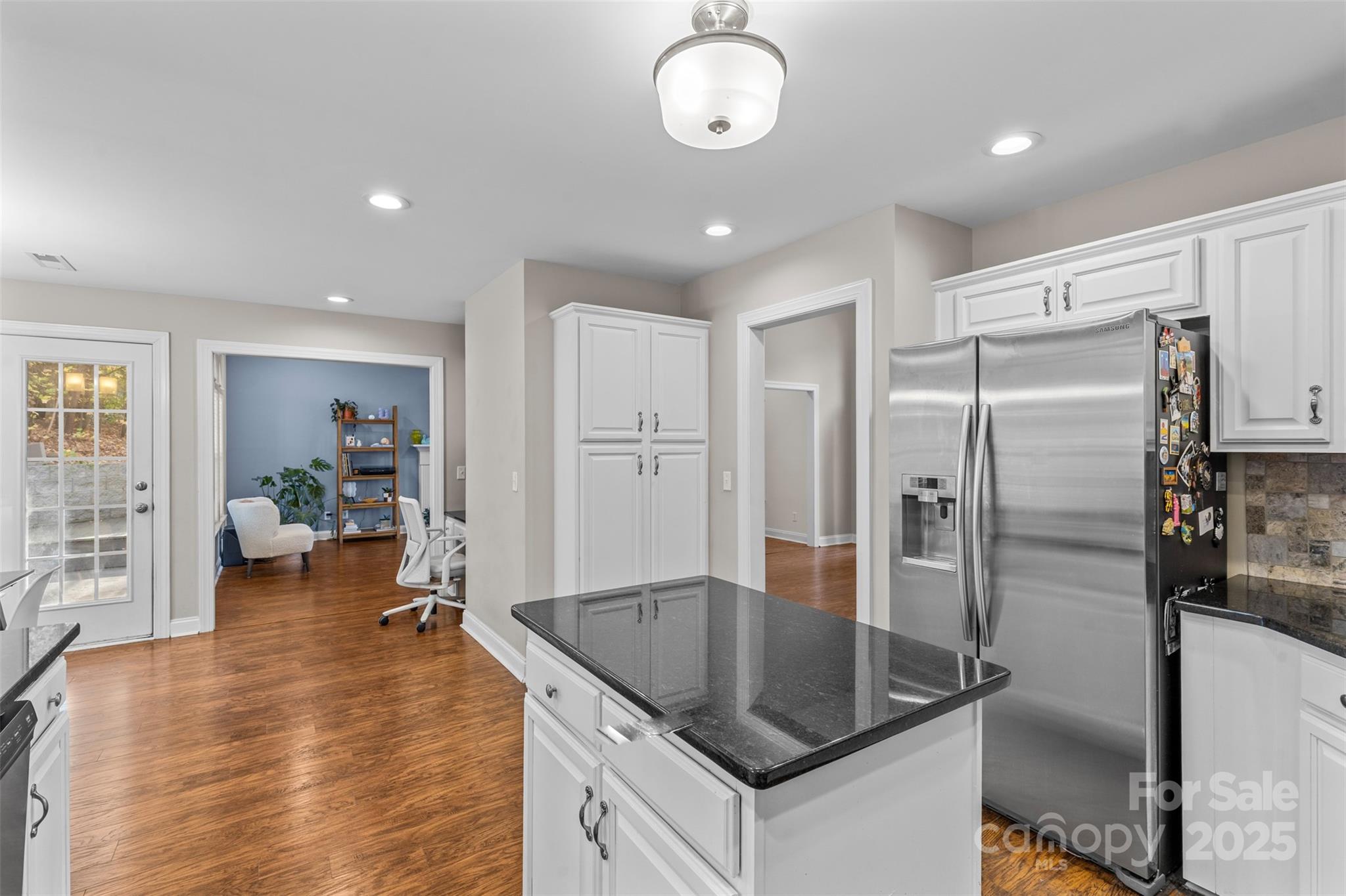 1108 Blowing Rock Cove Fort Mill, SC 29708 - Photo 14 of 43 a kitchen with kitchen island a counter top space cabinets and stainless steel appliances