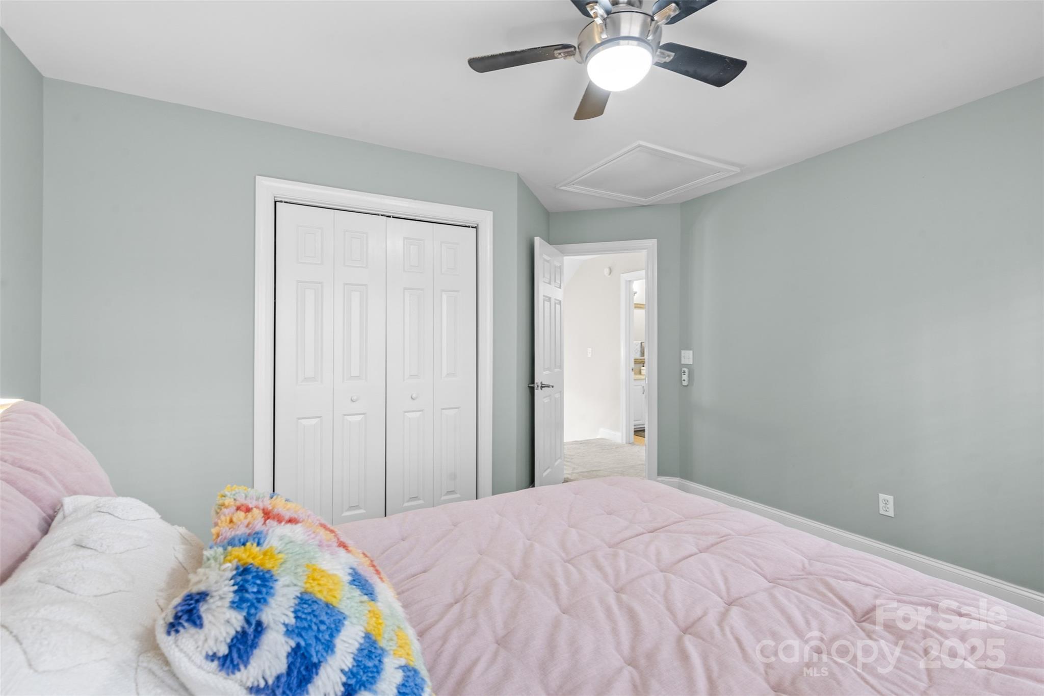 1108 Blowing Rock Cove Fort Mill, SC 29708 - Photo 29 of 43 a bedroom with a bed and a chandelier