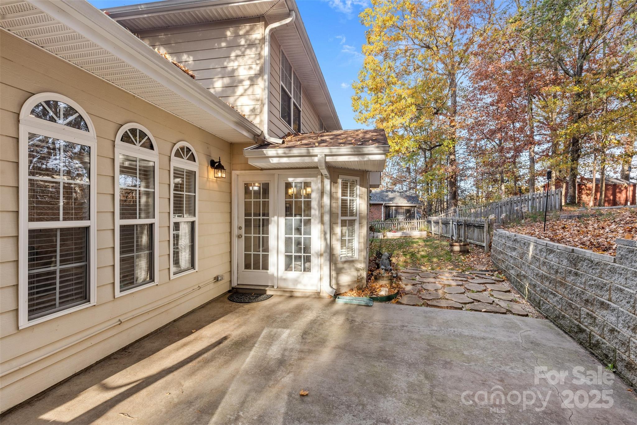 1108 Blowing Rock Cove Fort Mill, SC 29708 - Photo 30 of 43 a view of a brick house with large windows