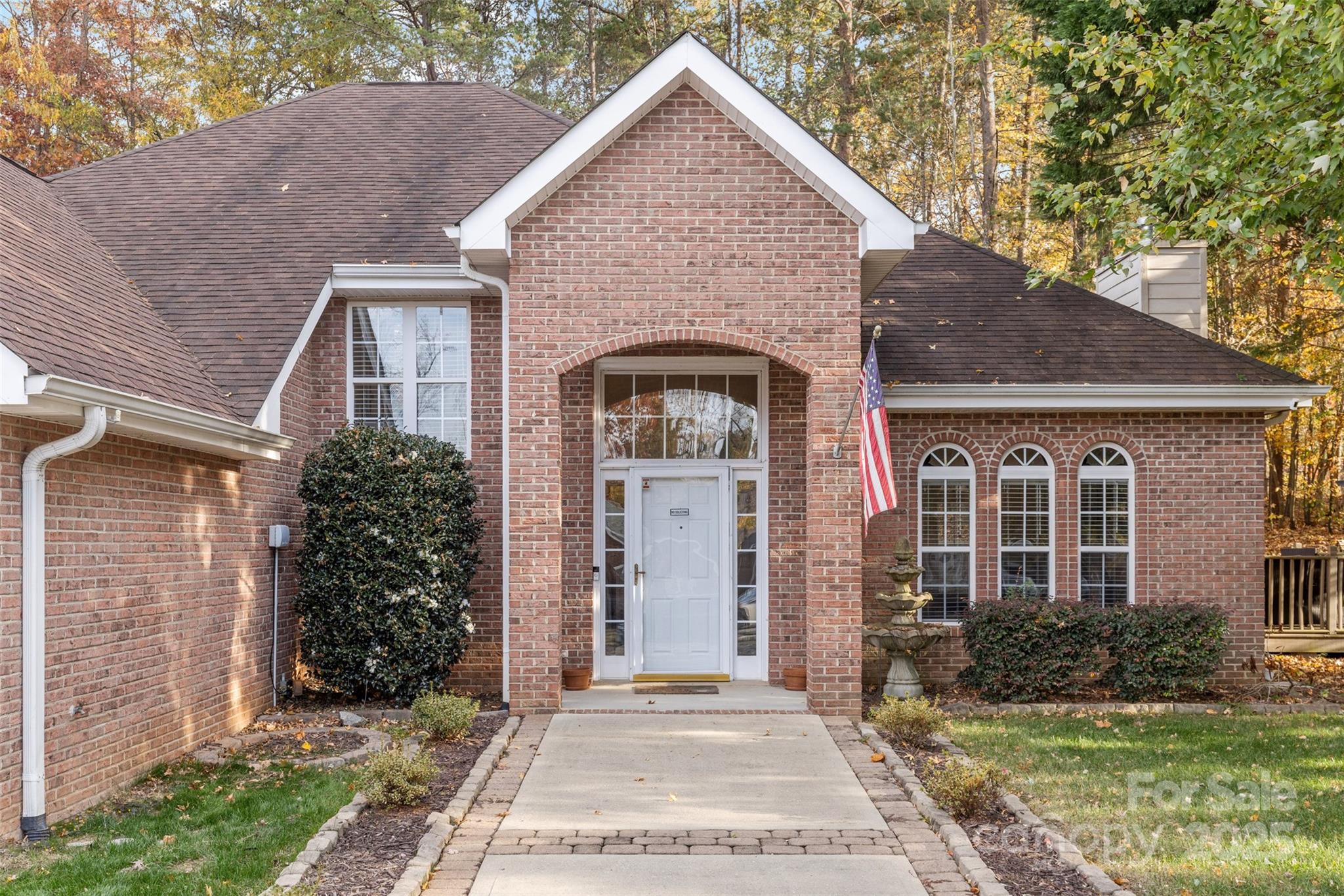 1108 Blowing Rock Cove Fort Mill, SC 29708 - Photo 4 of 43 a front view of a house with a garden