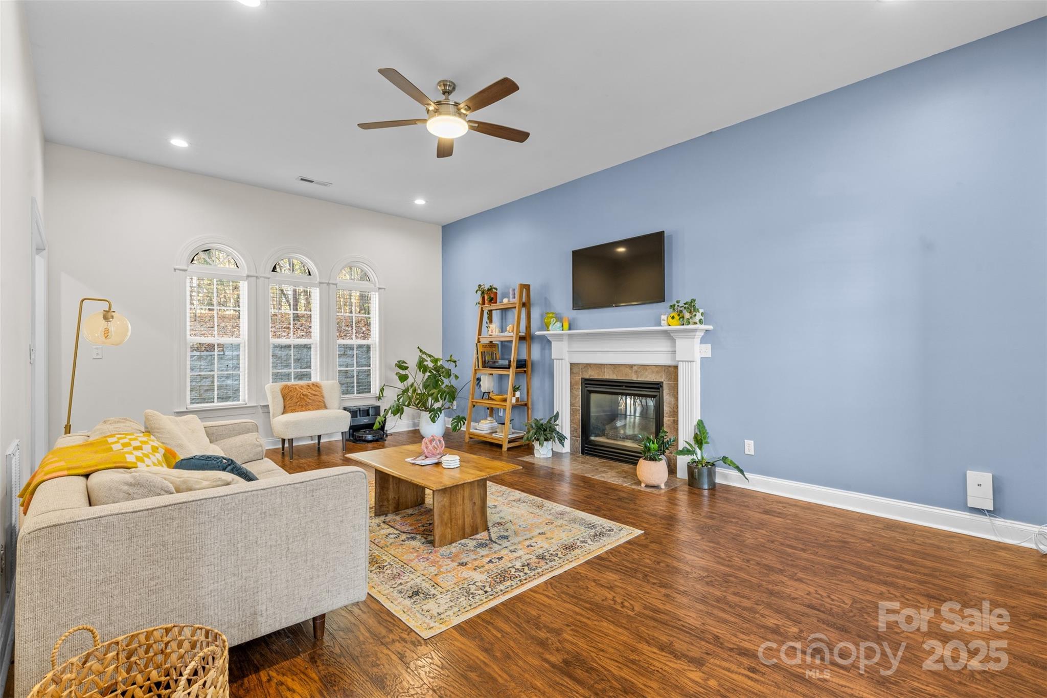 1108 Blowing Rock Cove Fort Mill, SC 29708 - Photo 6 of 43 a living room with furniture fireplace and a flat screen tv