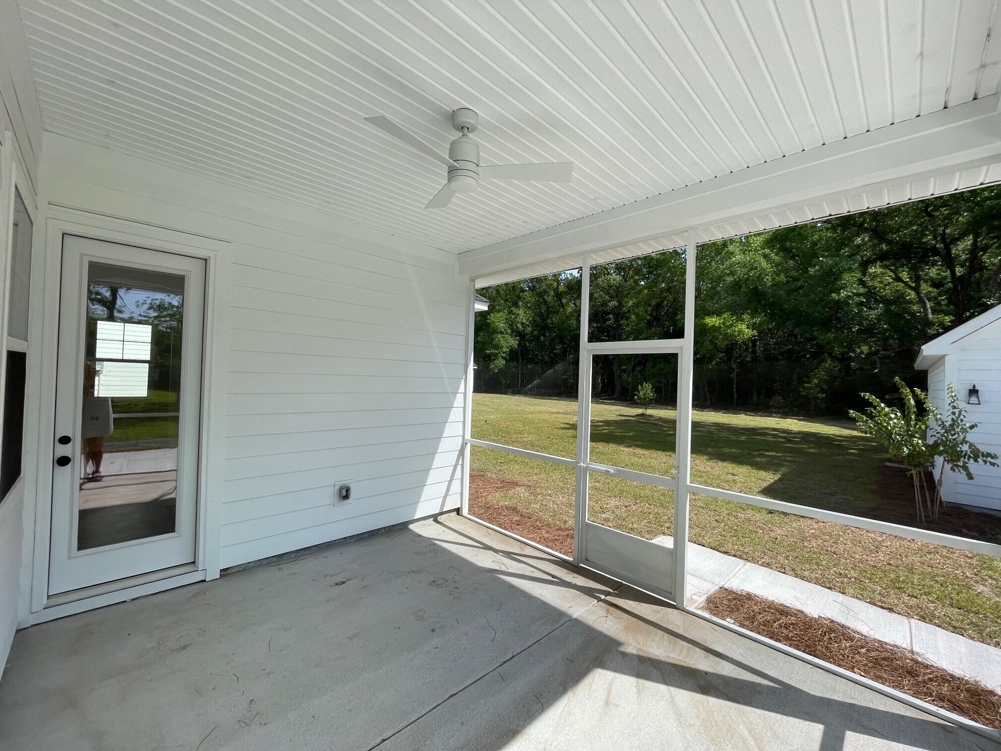1050 Theodore Road Awendaw, SC 29429 - Photo 8 of 24 Screened In Back Porch