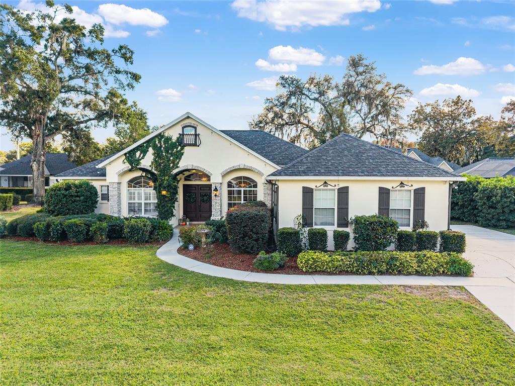 2720 Southeast 29th Street Ocala, FL 34471 - Photo 1 of 1 a front view of a house with a yard