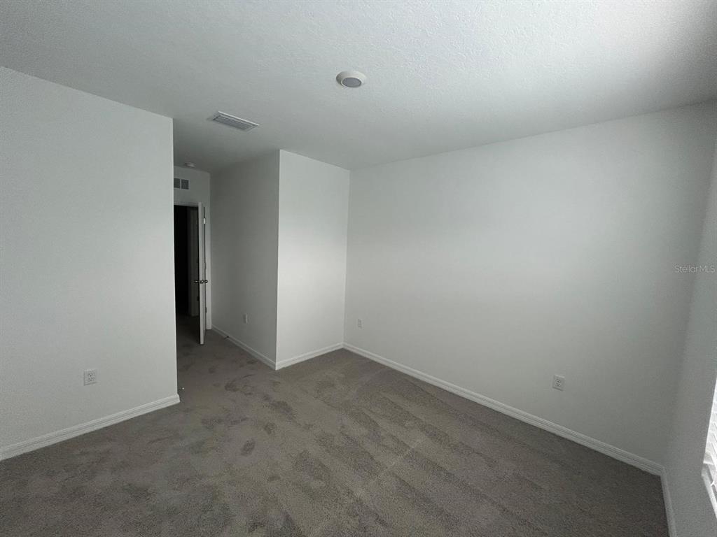 16620 Grotto Steam Place Wimauma, FL 33598 - Photo 16 of 19 a view of an empty room