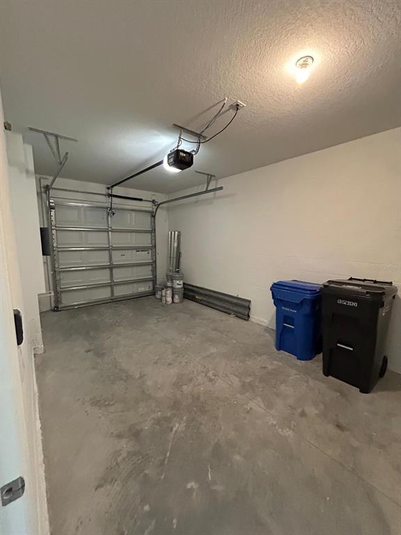 16620 Grotto Steam Place Wimauma, FL 33598 - Photo 9 of 19 a view of a garage room
