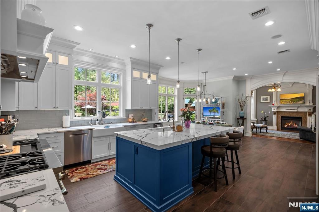 29 North Church Road Saddle River, NJ 07458 - Photo 11 of 42 a kitchen with sink stove and cabinets