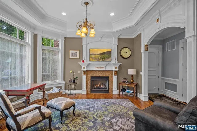 a bathroom with a sink a toilet a mirror and shower