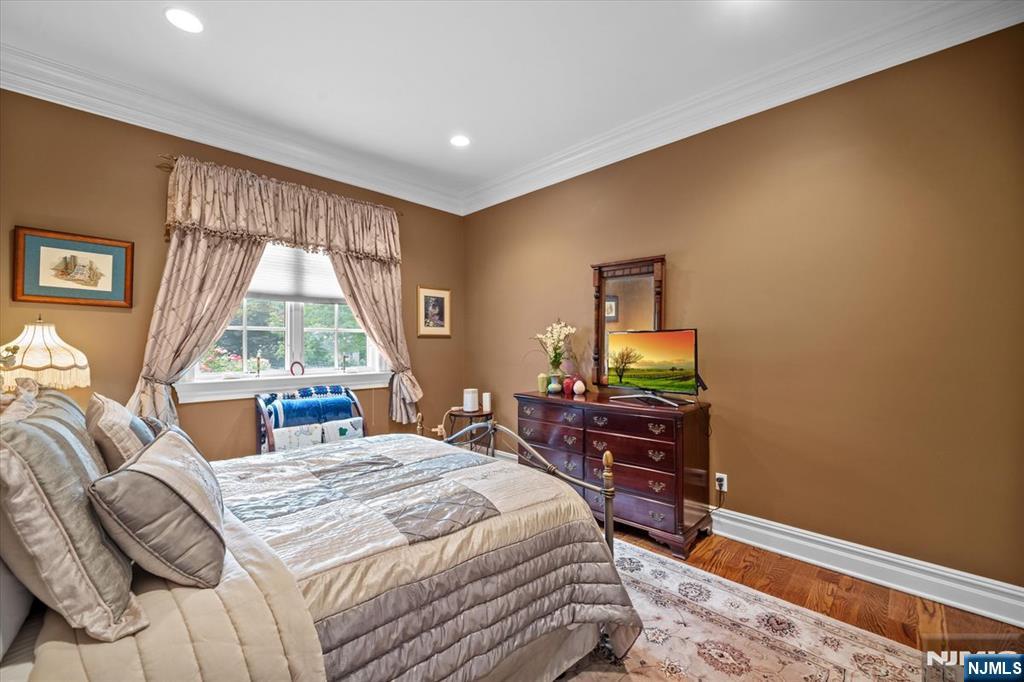 29 North Church Road Saddle River, NJ 07458 - Photo 18 of 42 a bedroom with a bed and large windows