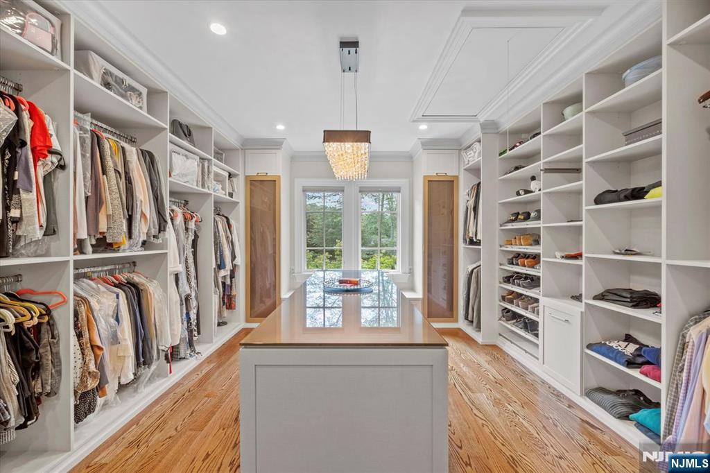 29 North Church Road Saddle River, NJ 07458 - Photo 22 of 42 a view of walk in closet with clothes and shoes