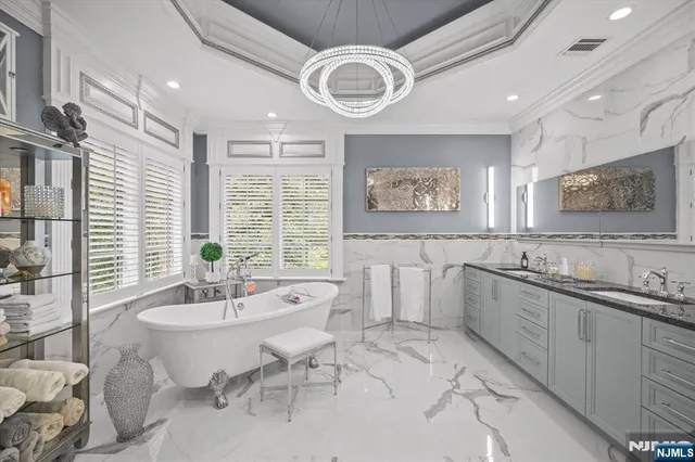 a front view of a house with a yard table and trees