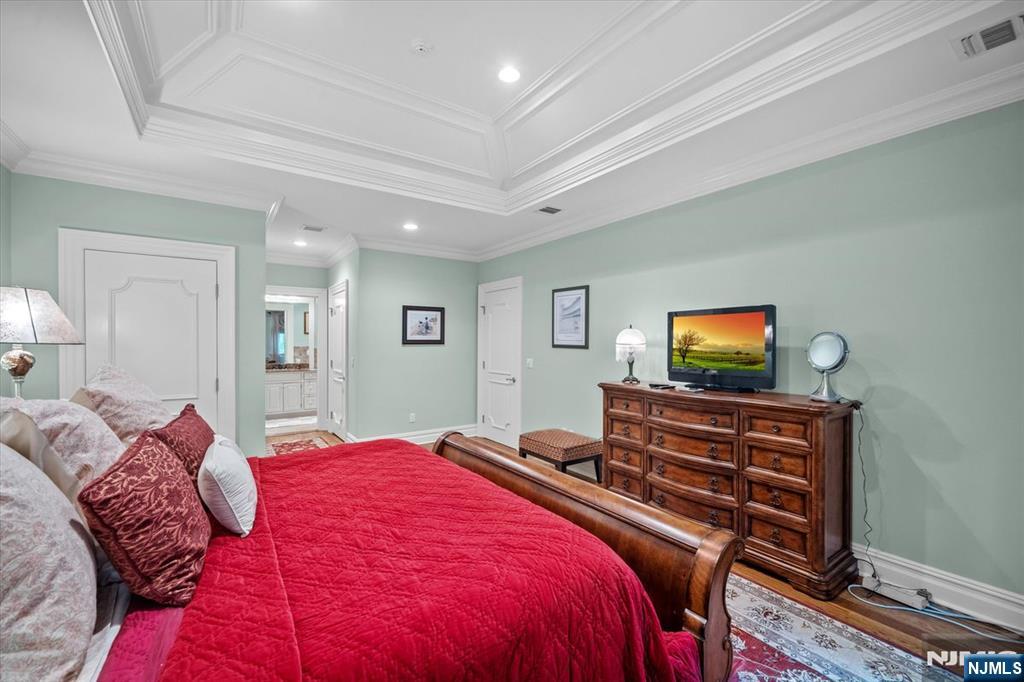 29 North Church Road Saddle River, NJ 07458 - Photo 26 of 42 a bedroom with a bed and a flat screen tv