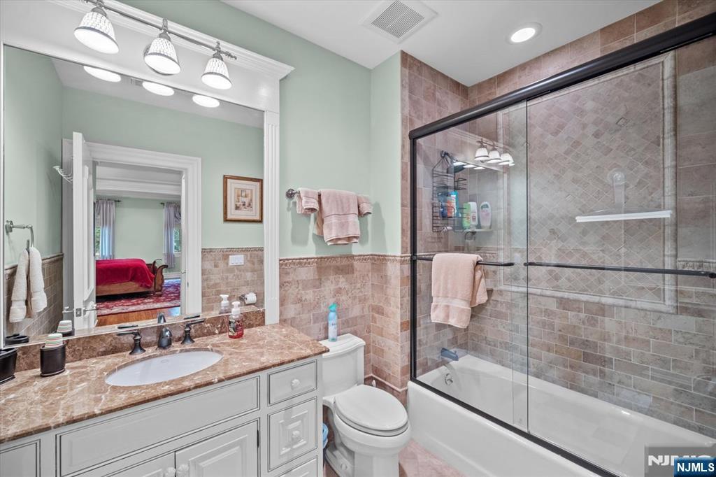 29 North Church Road Saddle River, NJ 07458 - Photo 28 of 42 a bathroom with a sink a toilet a mirror and shower