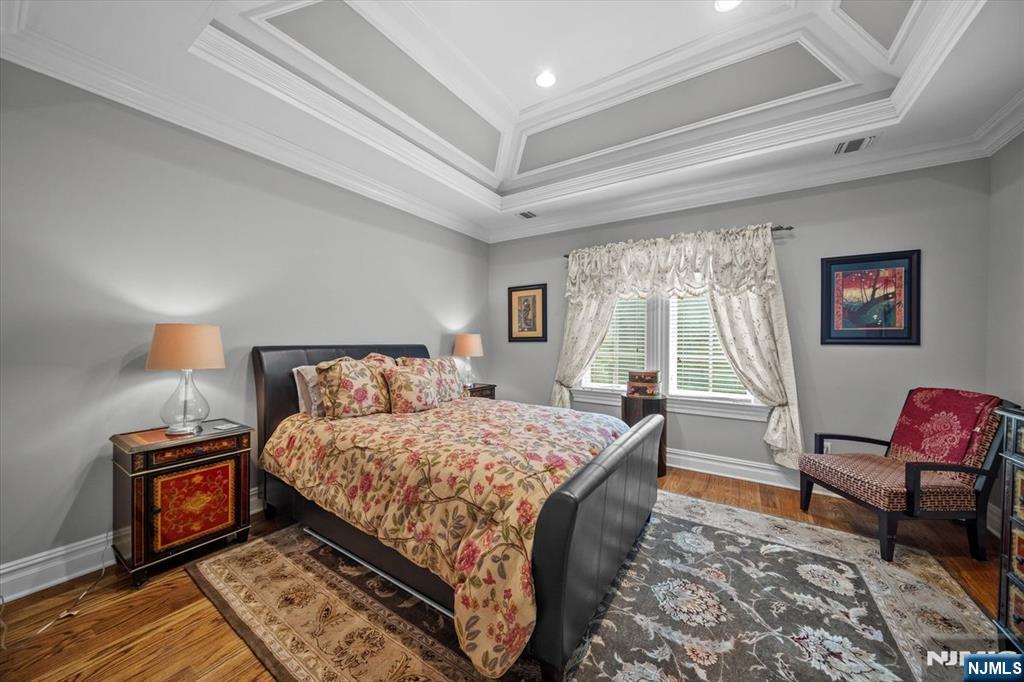 29 North Church Road Saddle River, NJ 07458 - Photo 30 of 42 a bedroom with a bed wooden floor and window