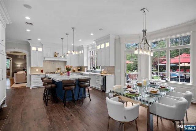 a bathroom with a granite countertop sink a toilet and shower