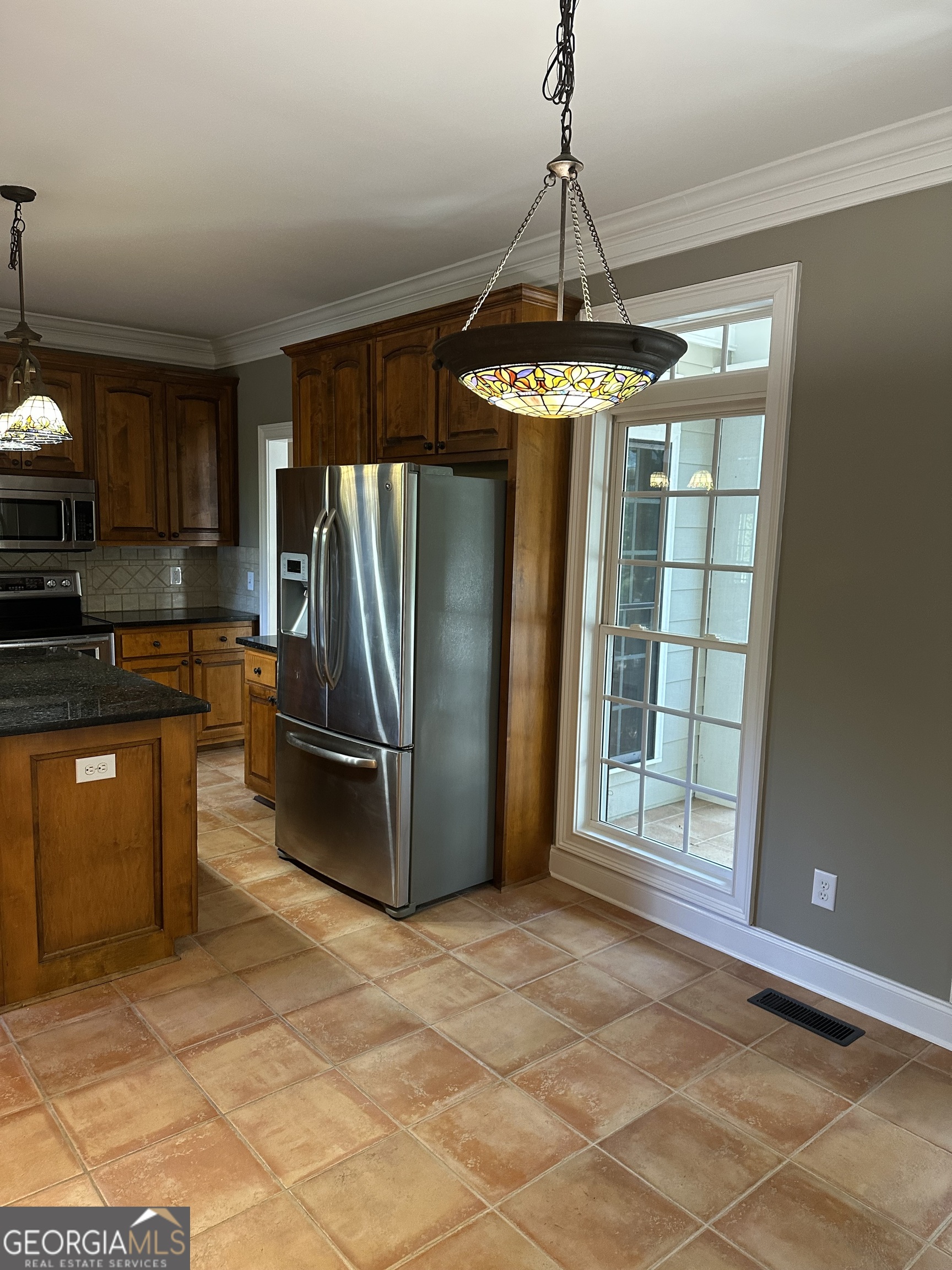 65 Spratlin Way Hull, GA 30646 - Photo 17 of 35 a kitchen with stainless steel appliances granite countertop a refrigerator a stove and a sink with granite countertops