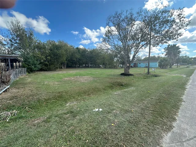 a view of a pool with a yard