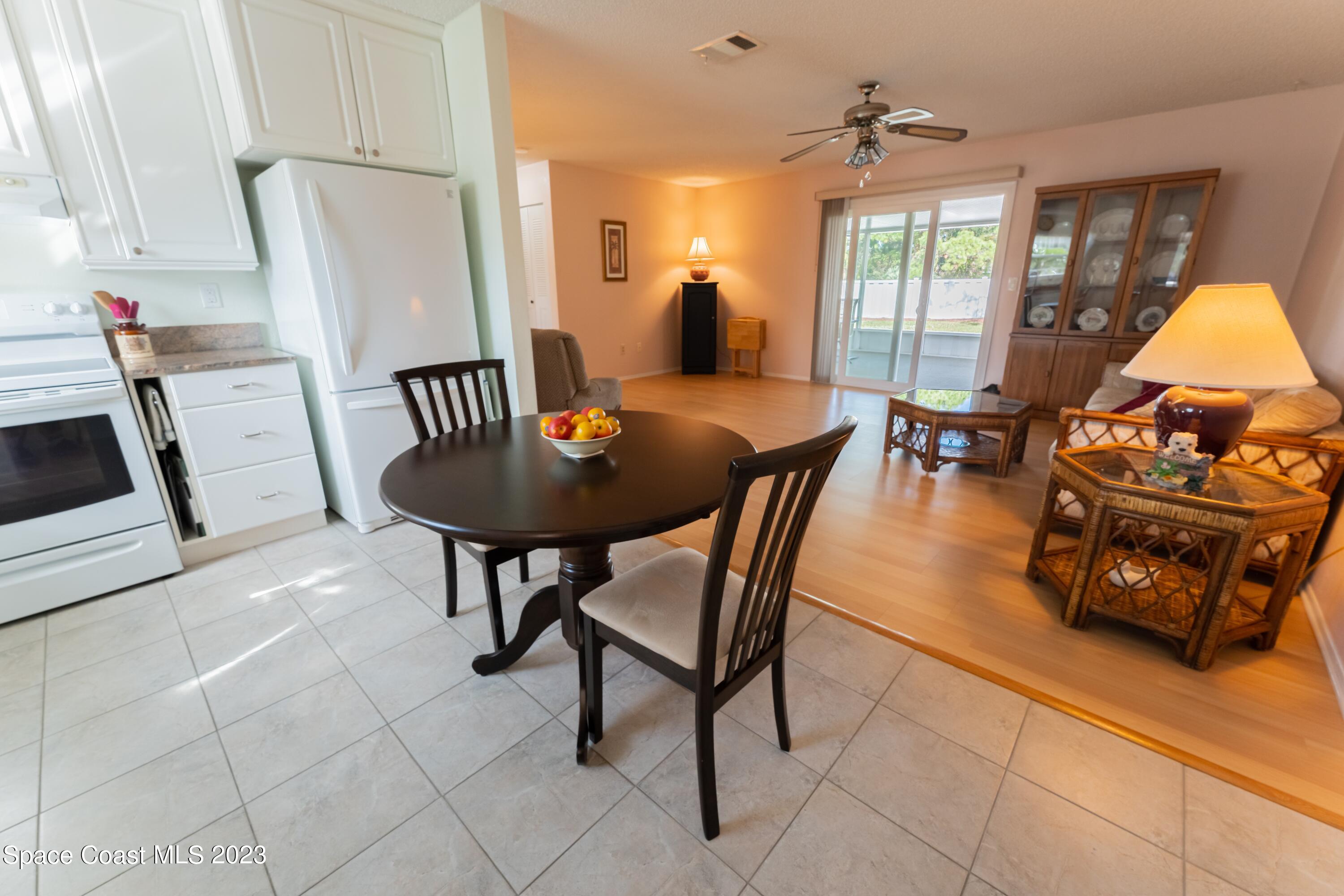 920 Gables Way Melbourne, FL 32940 - Photo 11 of 24 a view of a dining room with furniture and window