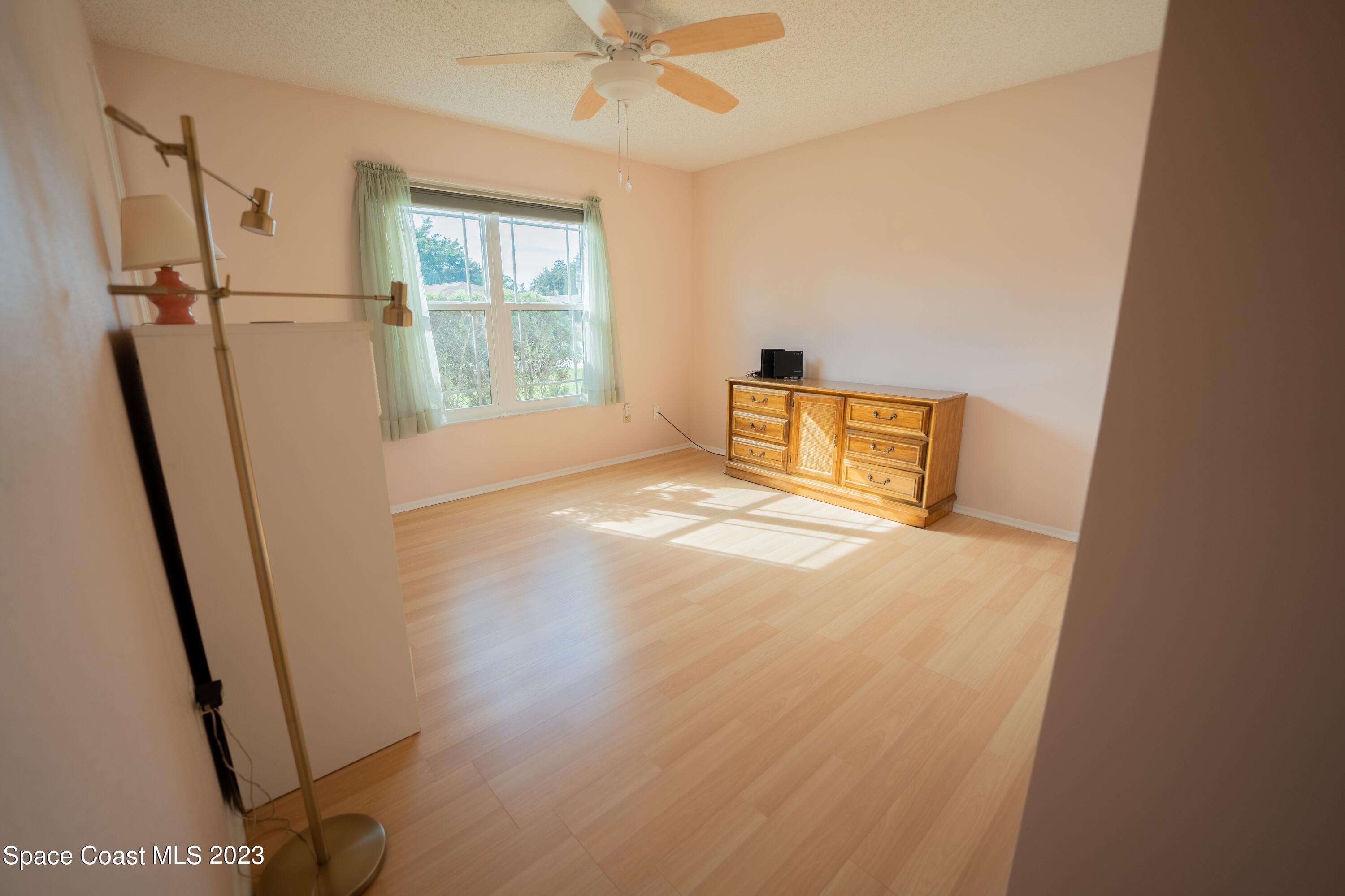 920 Gables Way Melbourne, FL 32940 - Photo 18 of 24 a view of an empty room with a window